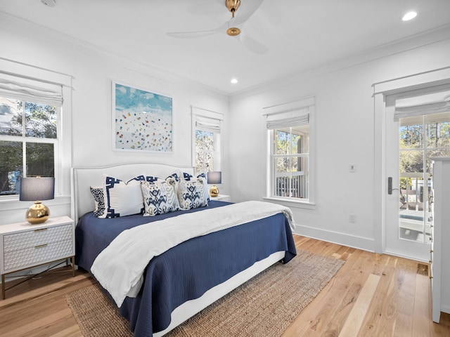 bedroom with crown molding, access to outside, multiple windows, and light wood-style flooring