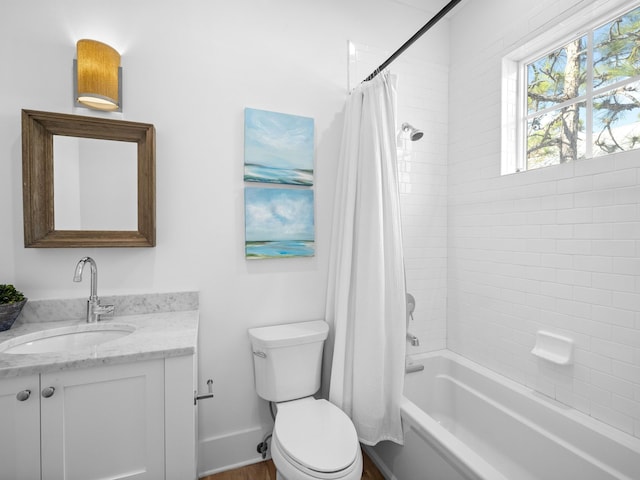 bathroom with vanity, toilet, baseboards, and shower / tub combo with curtain