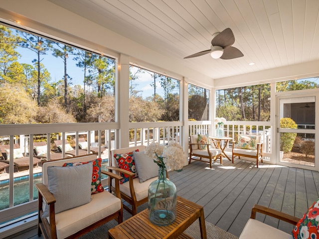 sunroom / solarium featuring wooden ceiling and ceiling fan