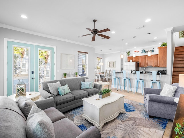 living room featuring ornamental molding, recessed lighting, french doors, and stairs