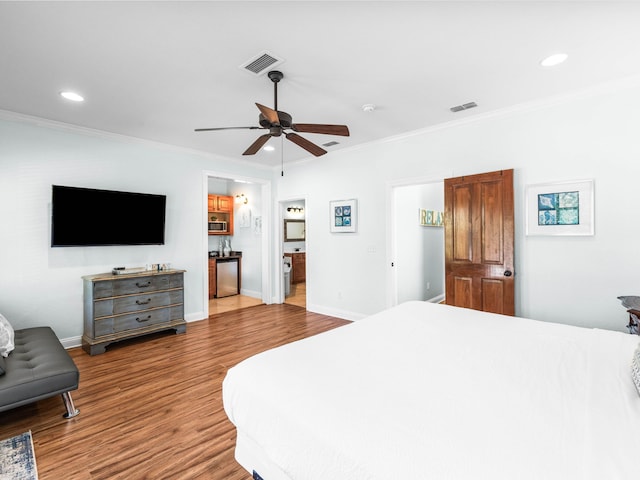 bedroom with recessed lighting, visible vents, crown molding, and wood finished floors