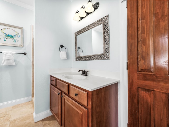 bathroom with baseboards and vanity