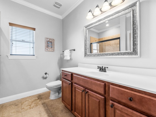 bathroom featuring crown molding, toilet, a shower with shower door, vanity, and baseboards