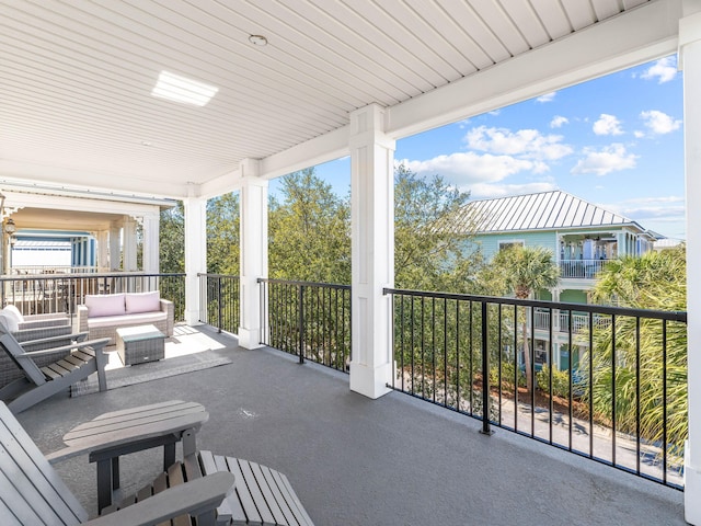 view of patio with a balcony and an outdoor living space