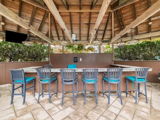 view of patio / terrace with outdoor dry bar and a gazebo