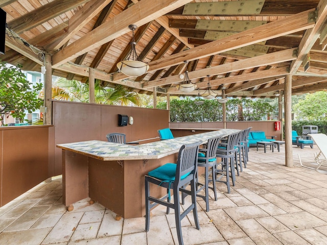 view of patio / terrace with exterior bar and a gazebo