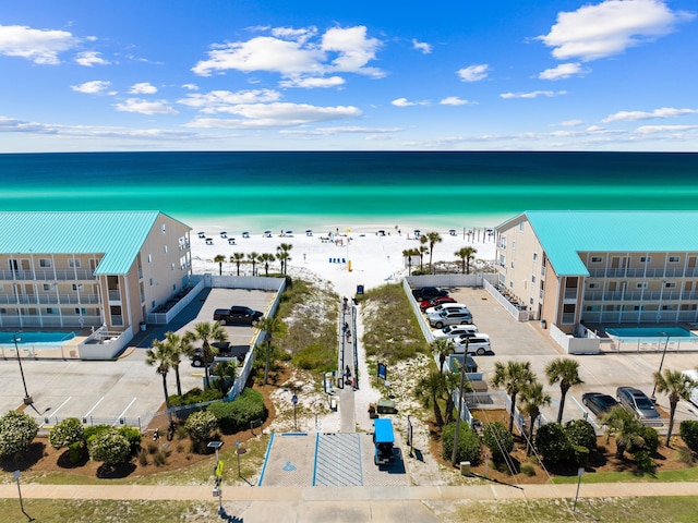 bird's eye view with a view of the beach and a water view