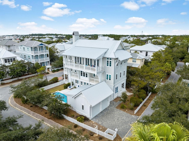 birds eye view of property with a residential view