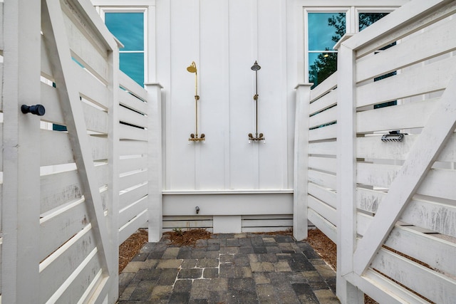 mudroom featuring brick floor