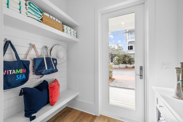 mudroom featuring light wood-type flooring and baseboards