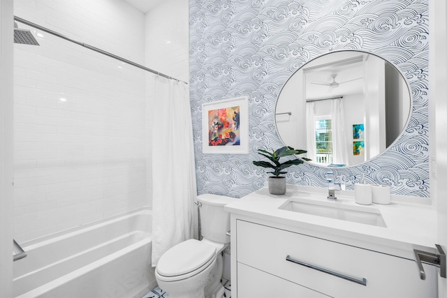 full bathroom featuring wallpapered walls, a ceiling fan, toilet, shower / bath combination with curtain, and vanity