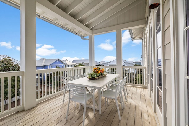 wooden terrace with outdoor dining area