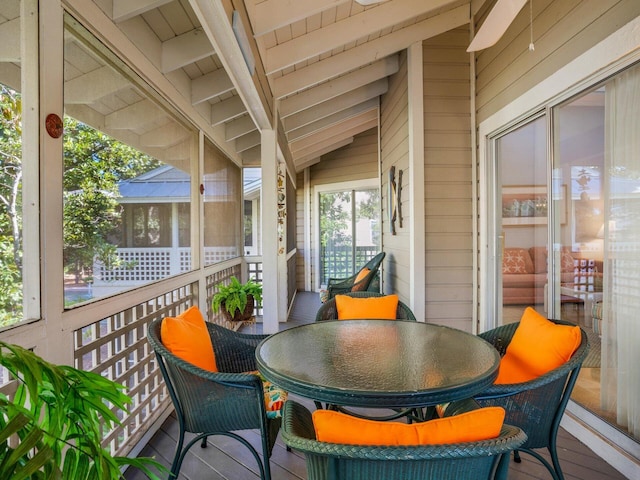 wooden deck featuring outdoor dining area