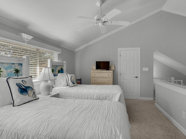 carpeted bedroom featuring lofted ceiling, ceiling fan, baseboards, and ornamental molding