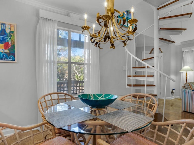 dining room featuring an inviting chandelier, stairs, and baseboards