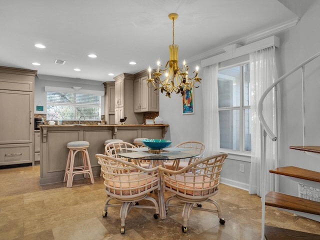 dining area featuring a notable chandelier, recessed lighting, visible vents, baseboards, and ornamental molding