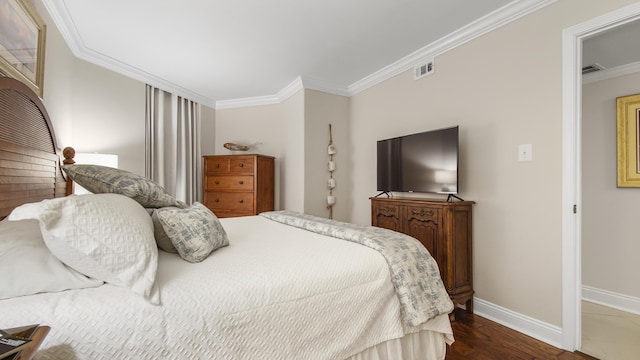 bedroom with visible vents, baseboards, dark wood-type flooring, and crown molding