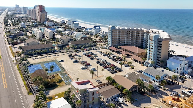 drone / aerial view with a city view and a water view