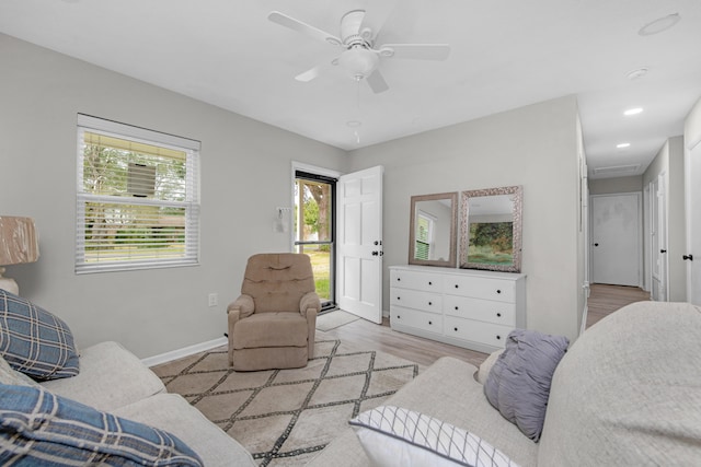 living area featuring recessed lighting, attic access, ceiling fan, wood finished floors, and baseboards