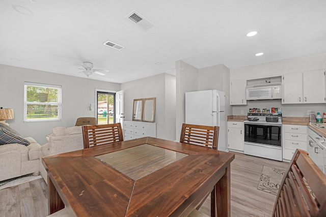 dining space with ceiling fan, light wood-type flooring, visible vents, and recessed lighting