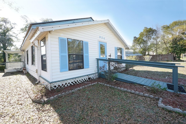 view of side of property with fence