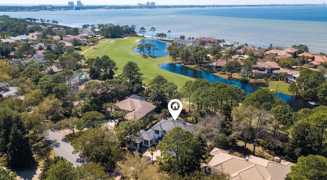 aerial view featuring a residential view, a water view, and view of golf course