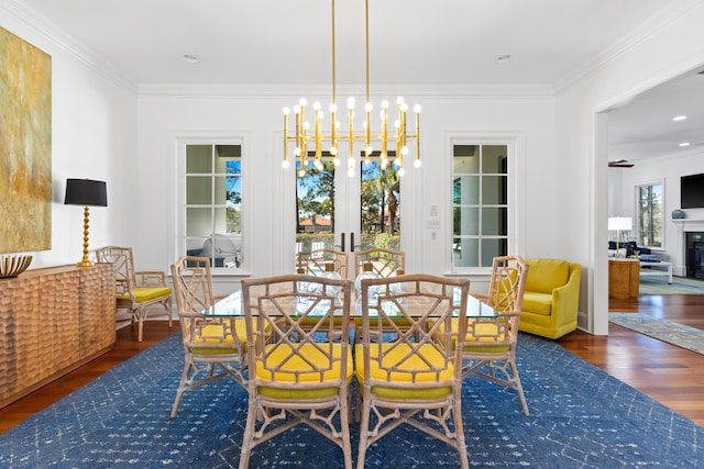 dining area with wood finished floors, french doors, and ornamental molding