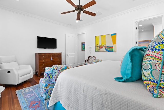 bedroom with a ceiling fan, wood finished floors, baseboards, and ornamental molding