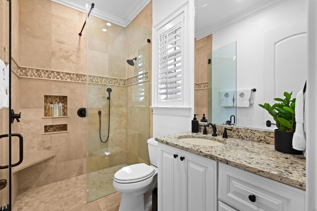 full bathroom featuring a shower stall, toilet, and ornamental molding