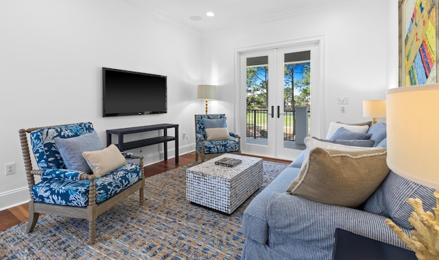 living room with wood finished floors, crown molding, french doors, and baseboards