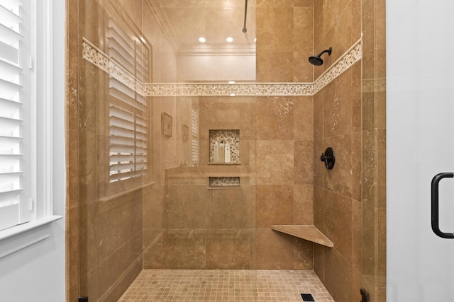 full bath with crown molding and a tile shower