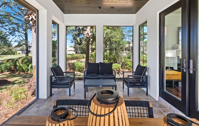 sunroom featuring wood ceiling