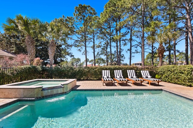 view of pool featuring a pool with connected hot tub