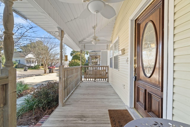 deck with covered porch and ceiling fan