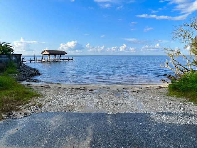 view of water feature featuring a view of the beach and a gazebo