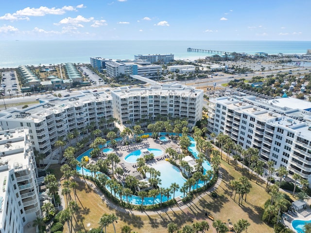 drone / aerial view featuring a view of city and a water view