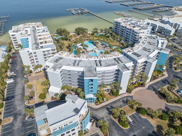 drone / aerial view featuring a water view and a view of city