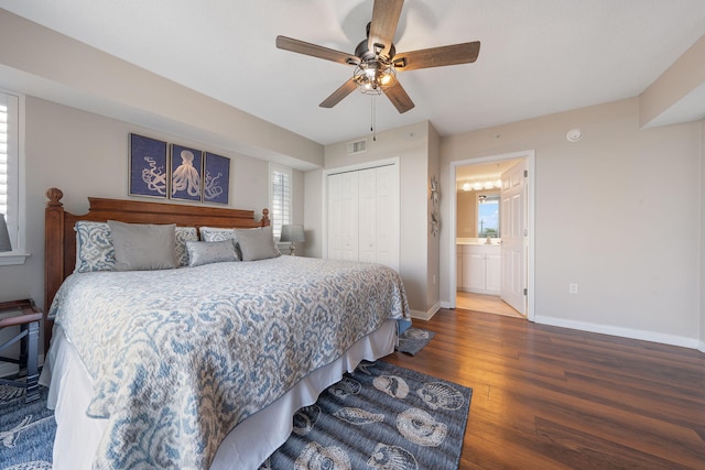 bedroom with wood finished floors, a ceiling fan, visible vents, baseboards, and a closet