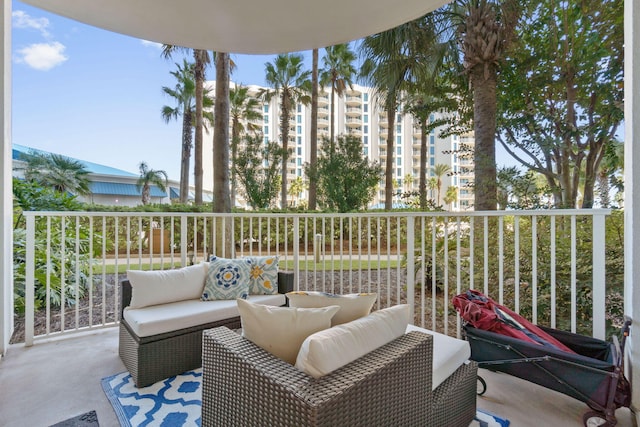 view of patio with a balcony and outdoor lounge area