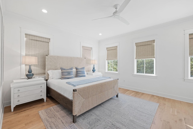 bedroom with ornamental molding, recessed lighting, light wood-style flooring, and baseboards