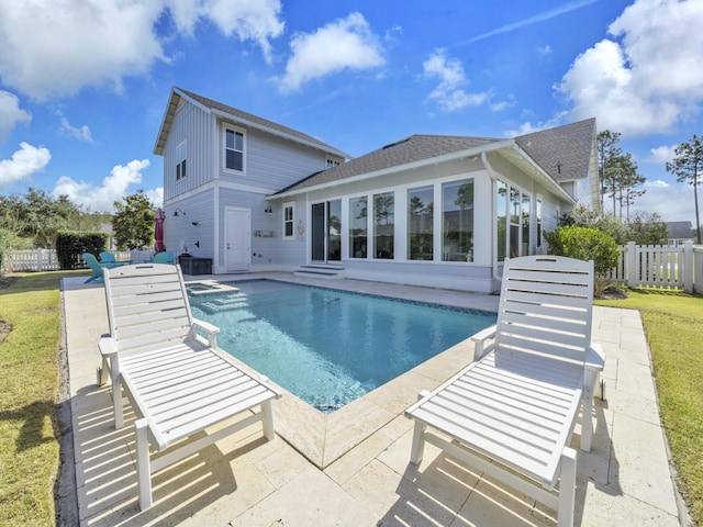 view of swimming pool with a patio, fence, and a fenced in pool