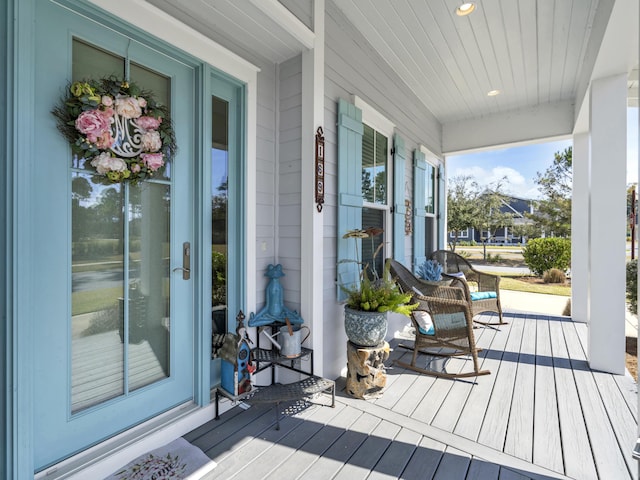 wooden terrace featuring a porch