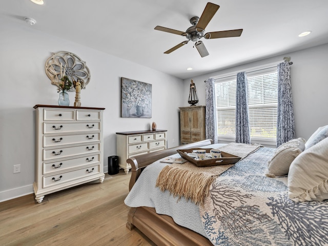 bedroom with a ceiling fan, recessed lighting, light wood-style flooring, and baseboards