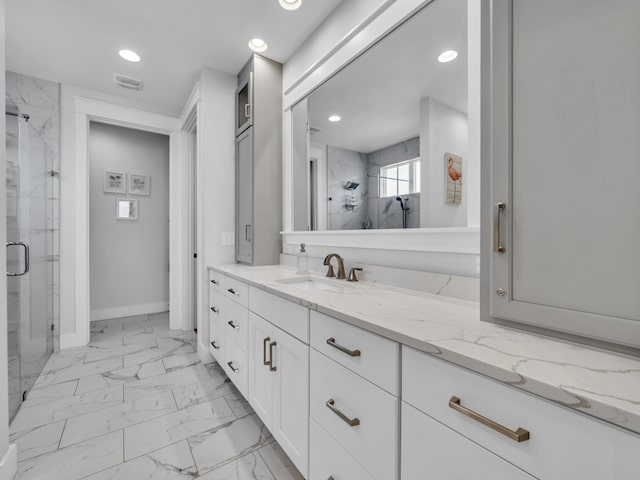 bathroom with visible vents, marble finish floor, a marble finish shower, and vanity