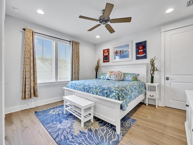 bedroom featuring light wood-style flooring, visible vents, baseboards, and recessed lighting