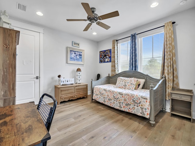 bedroom featuring baseboards, visible vents, ceiling fan, wood finished floors, and recessed lighting