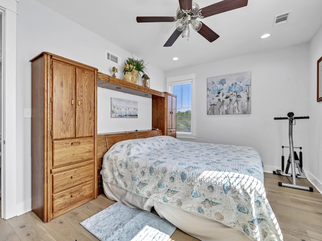 bedroom with recessed lighting, visible vents, and light wood-style flooring