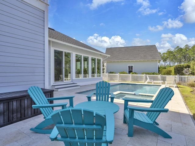 view of patio / terrace with a fenced in pool and fence