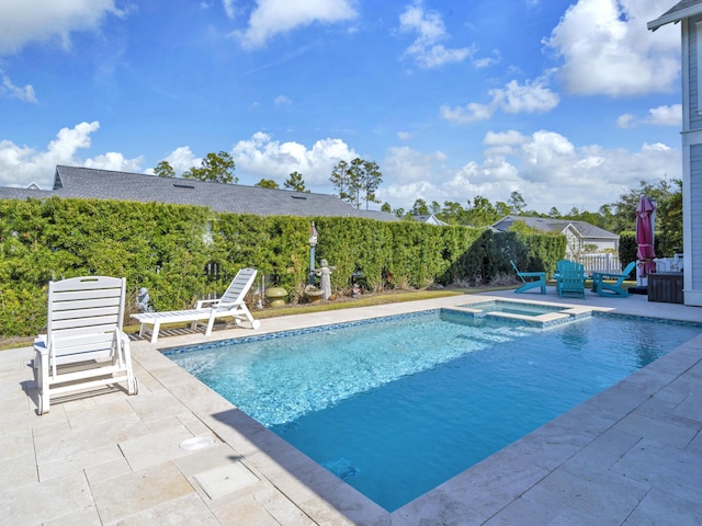 view of pool featuring a pool with connected hot tub and a patio