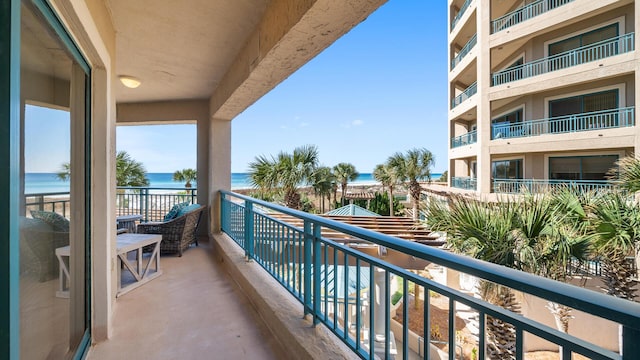 balcony featuring a water view